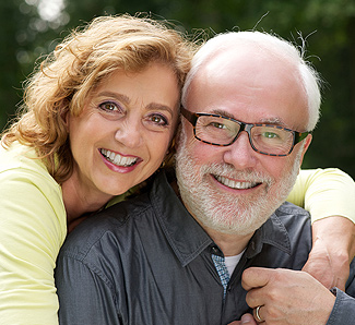 couple smiling and posing for photo