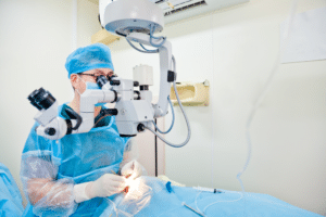 A surgeon performing cataract surgery on a patient in a sterile operating room in Boise.